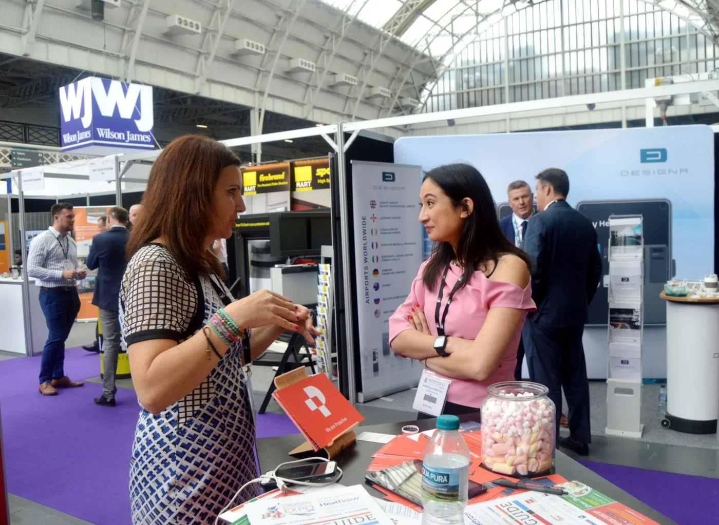 Talking to a visitor at the Proactive stand