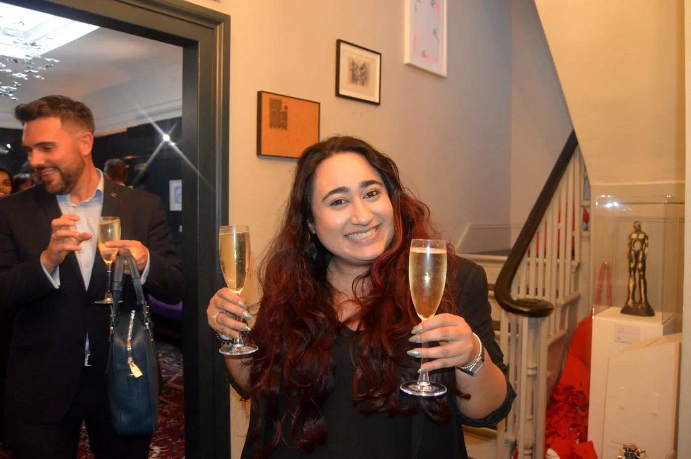 A double-handed champagne toast