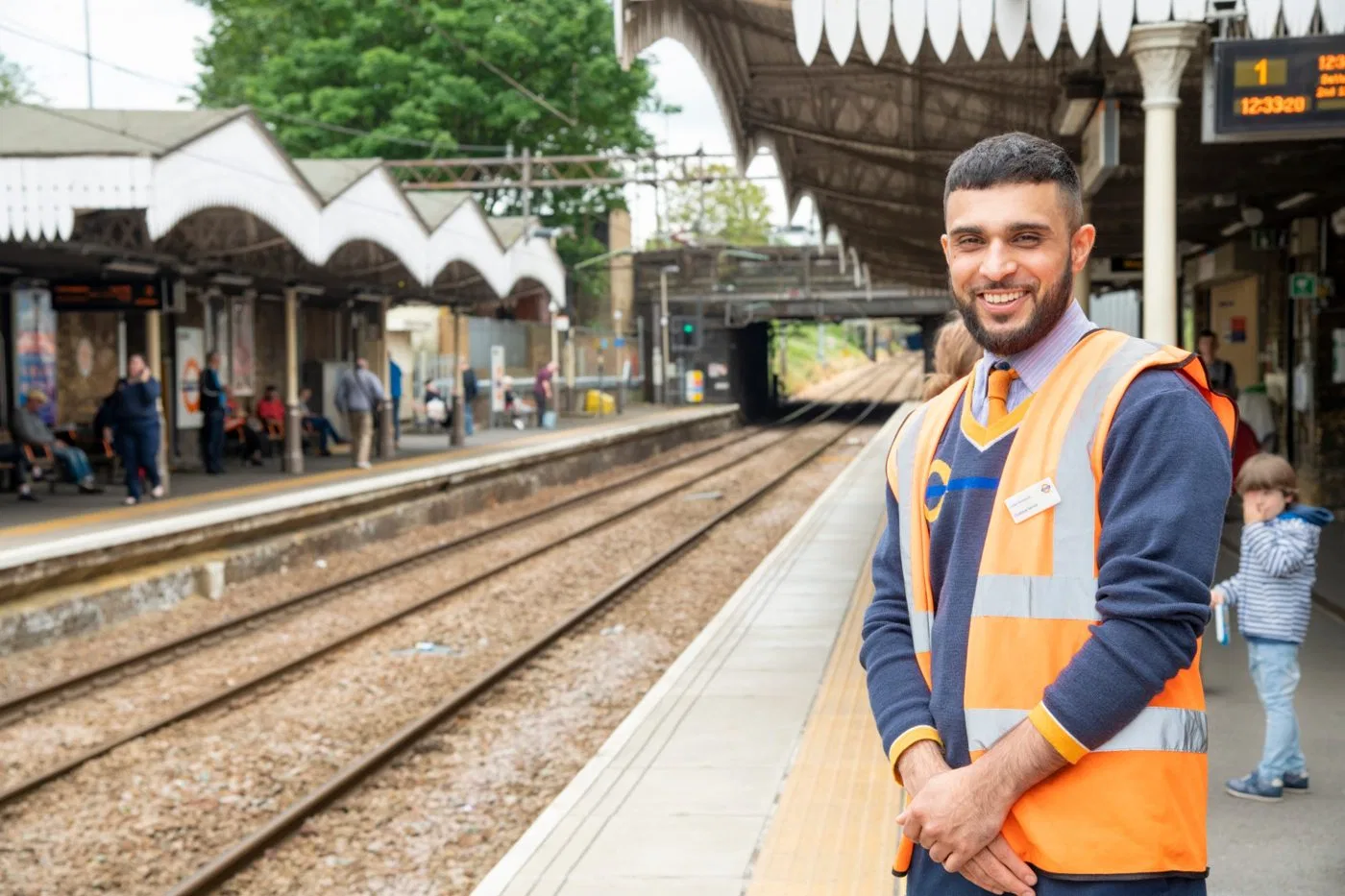Press photoshoot: a Proactive staff member on a London Overground platform